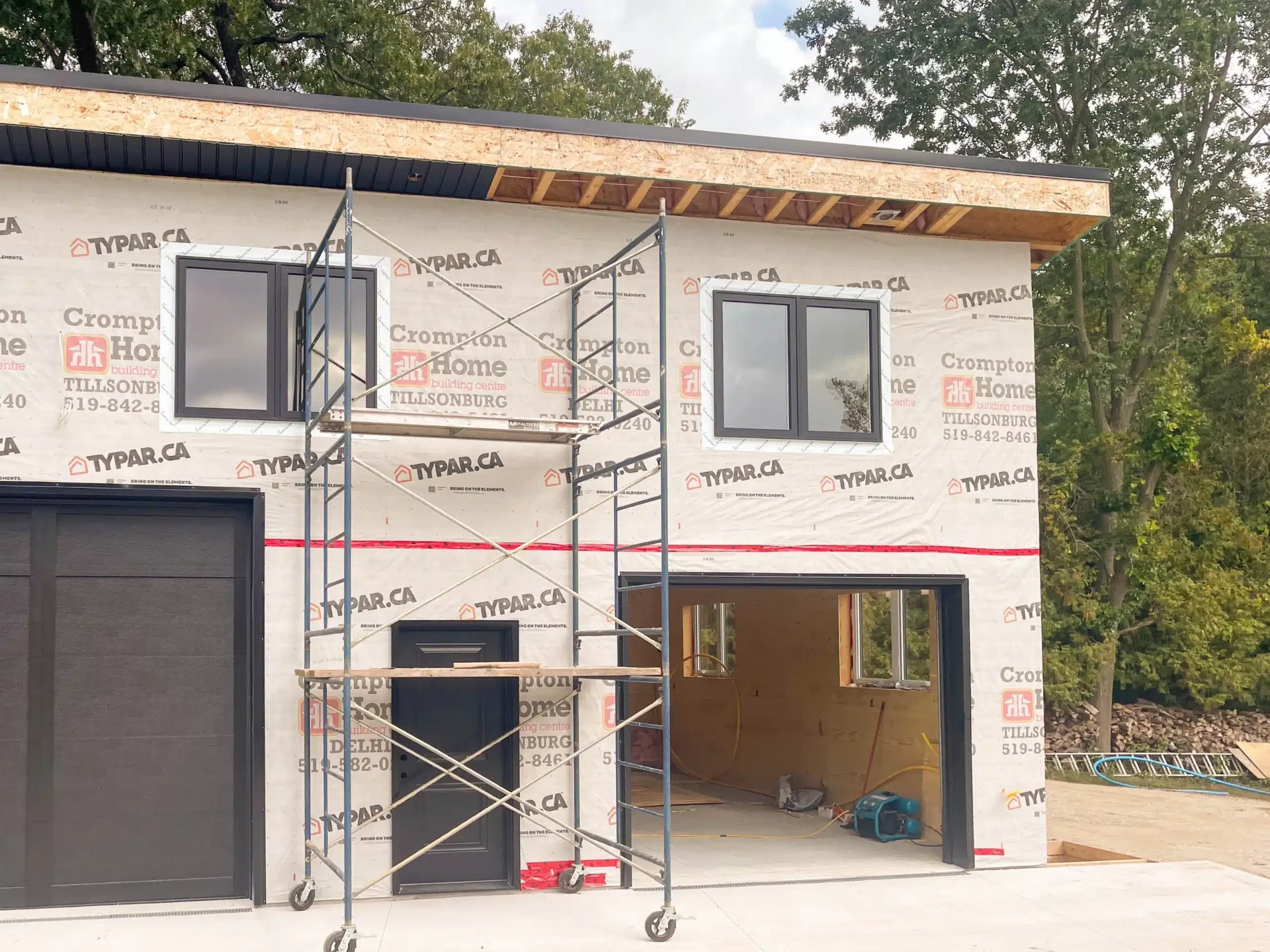 Two-storey addition under construction with scaffolding